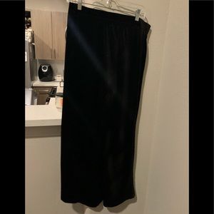 NWT black velvet bell bottom pants. Size L.